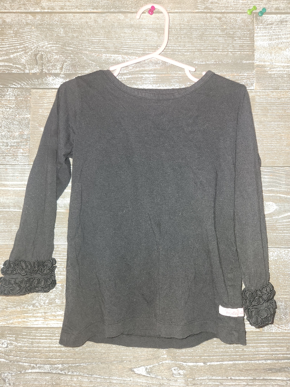 Ruffle Butts Black Long Sleeve Tee with Ruffle Cuff Detail